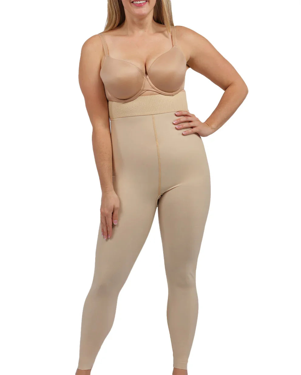 Front view of a woman wearing a beige compression girdle