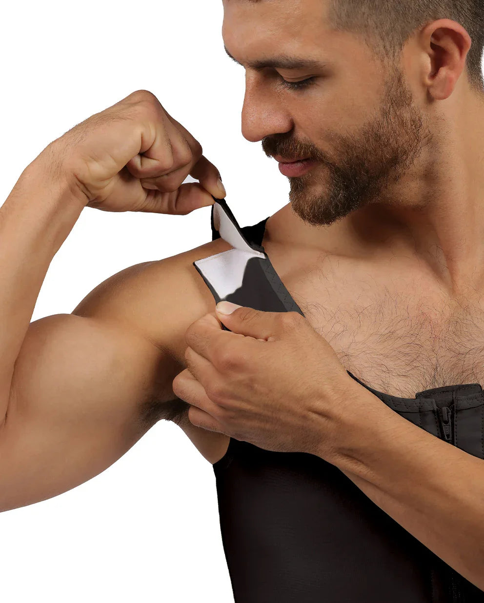 Man fastening his black compression vest shoulder strap, close-up view
