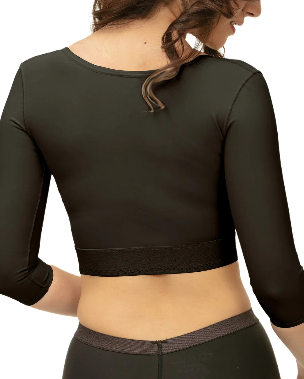 Back view of female model wearing black post surgical compression sleeves