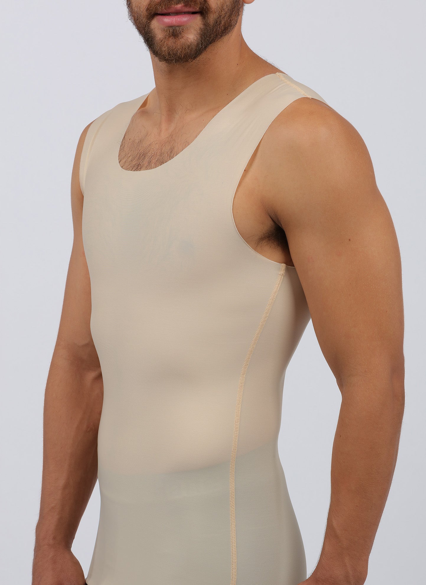 Male model wearing post surgical compression top in beige