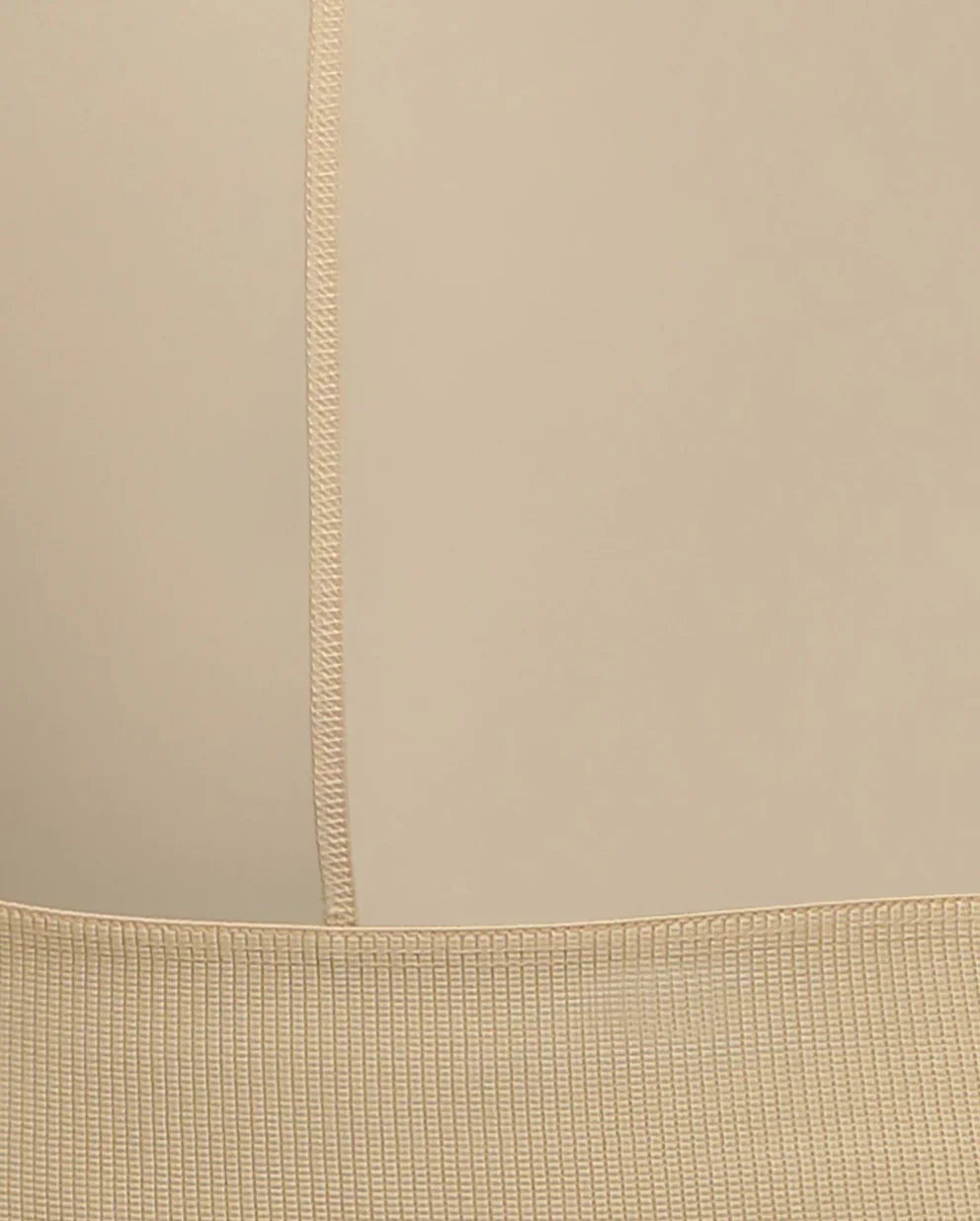 Close-up view of compression wear beige fabric