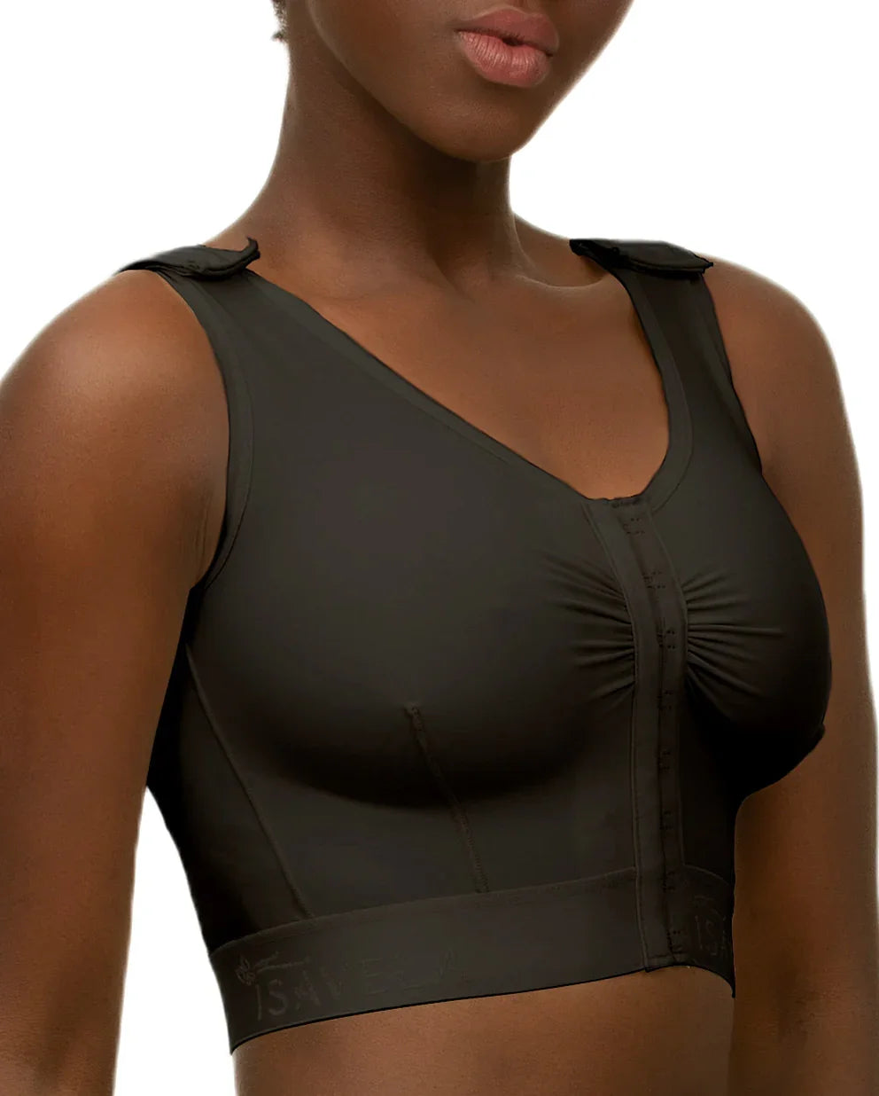 Side profile of the Bianca compression vest, highlighting the flat-seamed design and plush 2-inch elastic waistband for torso stability.